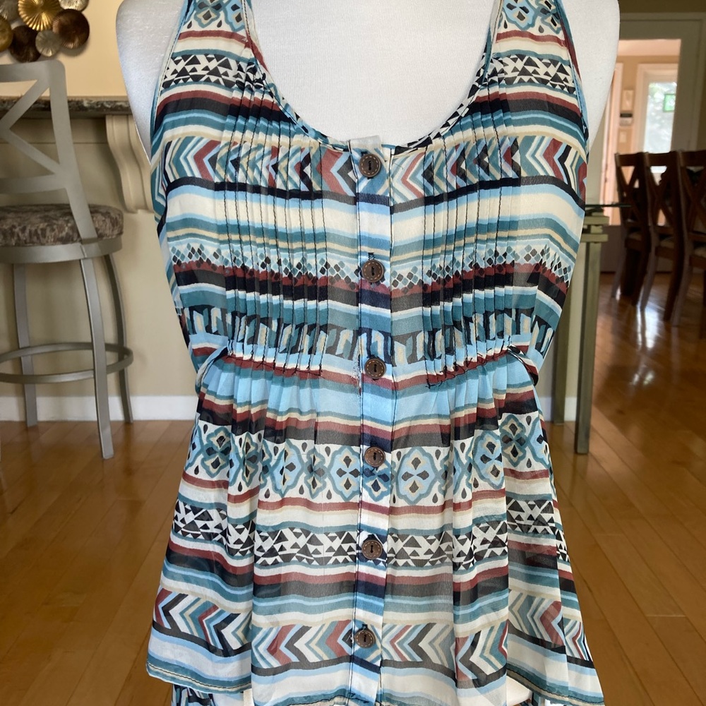 Aztec print chiffon top with tucks and lace inset.